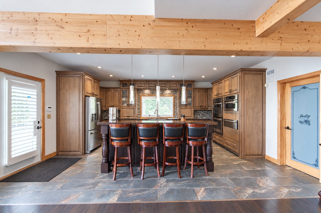 Clubhouse: the kitchen with a large island and bar stools