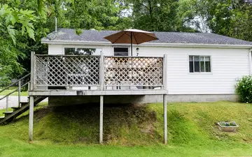 Eagle's Nest and its raised deck with a patio umbrella