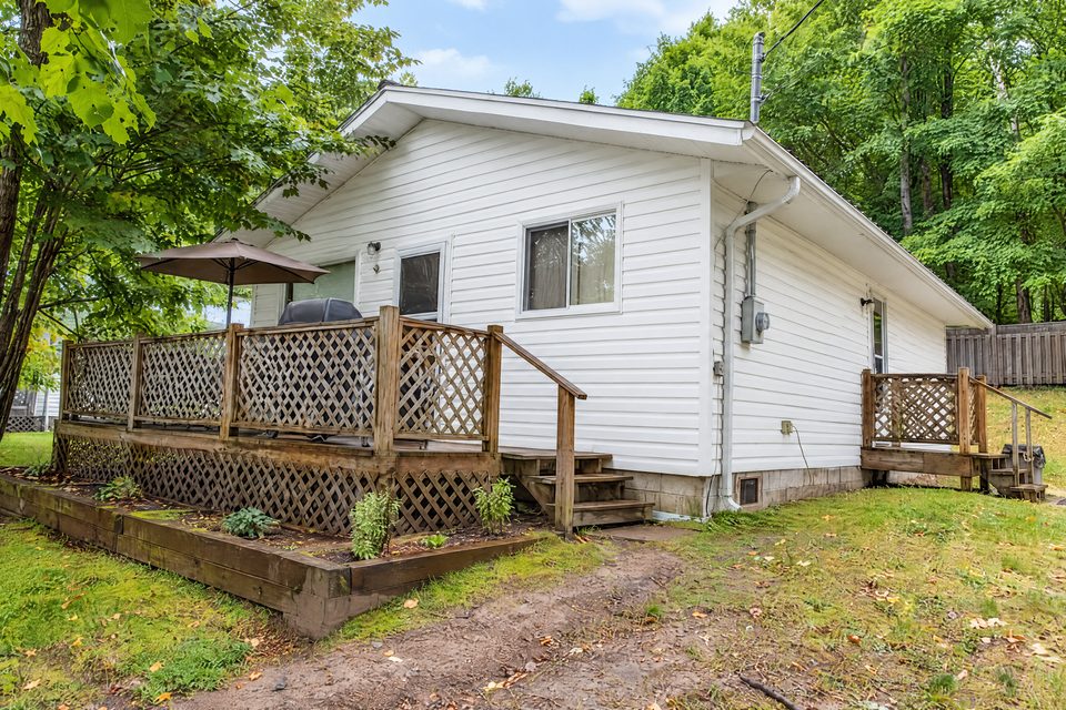 Hideaway and its two decks among the trees