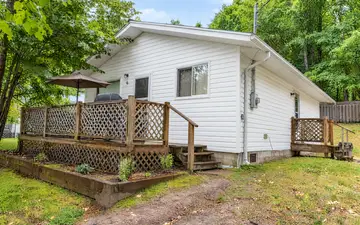Hideaway and its two decks among the trees