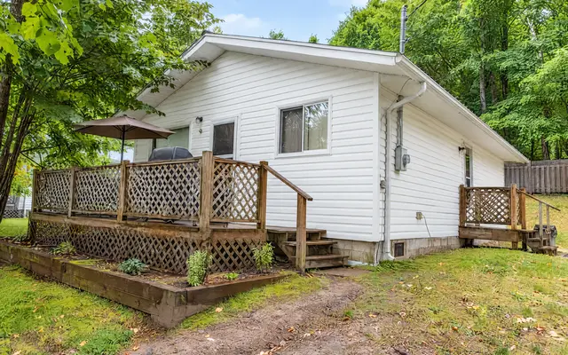 Hideaway and its two decks among the trees