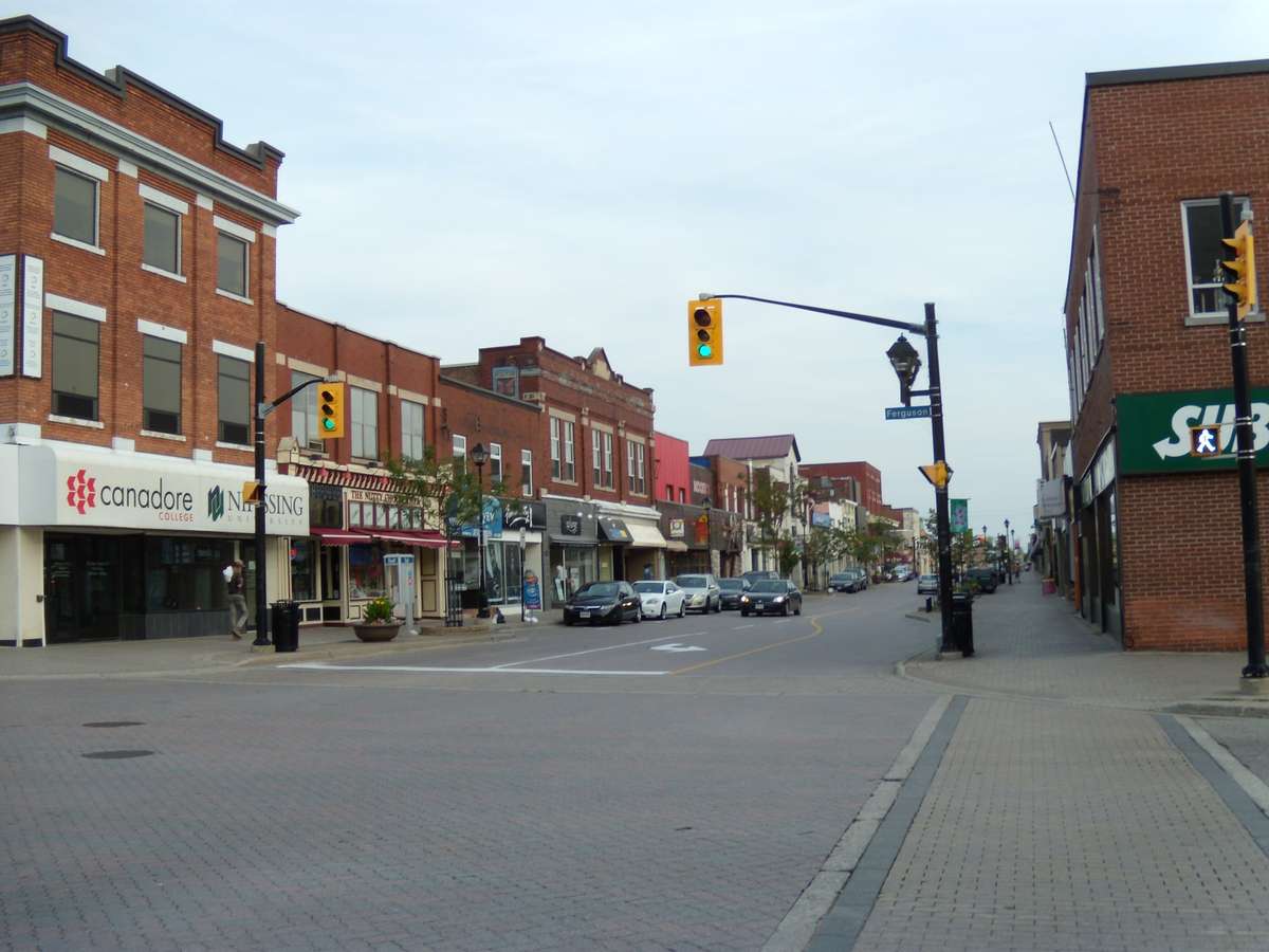 Brick storefronts along Main Street at Ferguson Street in downtown North Bay, photographed in 2012