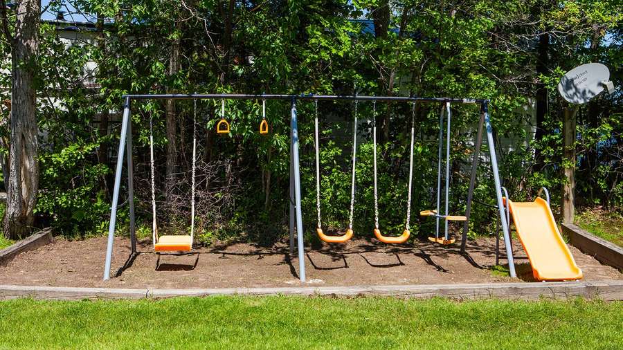 The swing set and slide on the playground