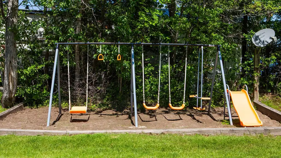 The swing set and slide on the playground