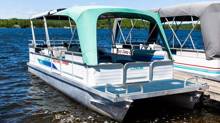The 24 ft hard-top pontoon at the shore