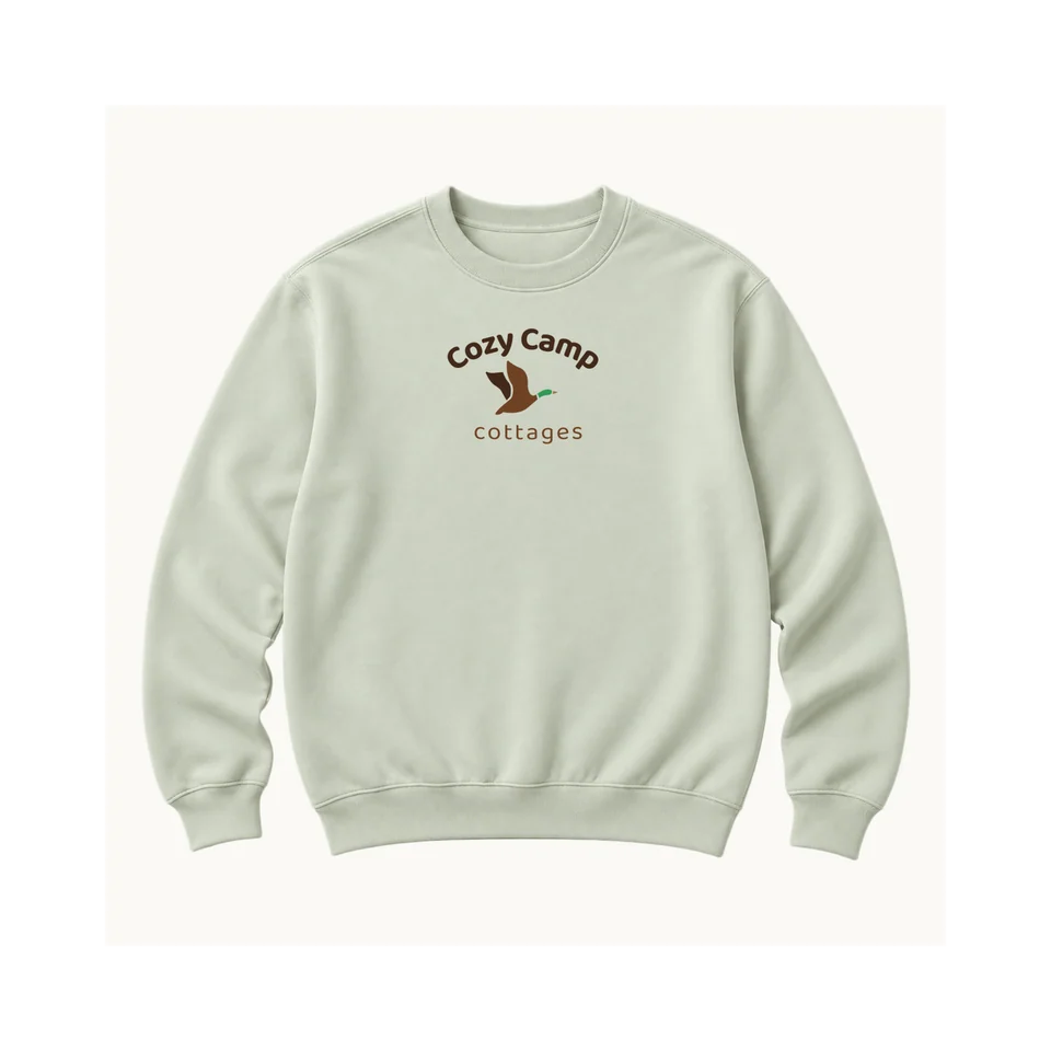 The Lakeside Crewneck in Sage, whole product, original Cozy Camp chest or crown design, product concept