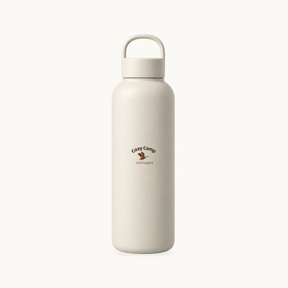 The Lakeside Water Bottle in Ivory, upright bottle, screw-top lid and carry handle, product concept